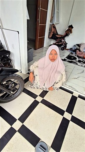 Deflating the Satria's tire and getting scolded by his mom