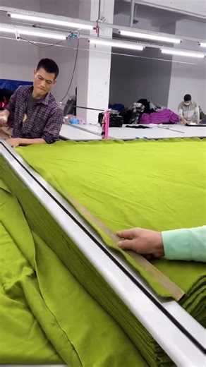 the process of cutting and measuring fabric materials #shorts