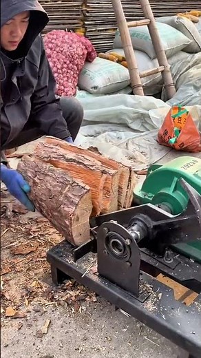 He digs the tree trunk thoroughly using proper tools to shape and remove the outer layer safely now