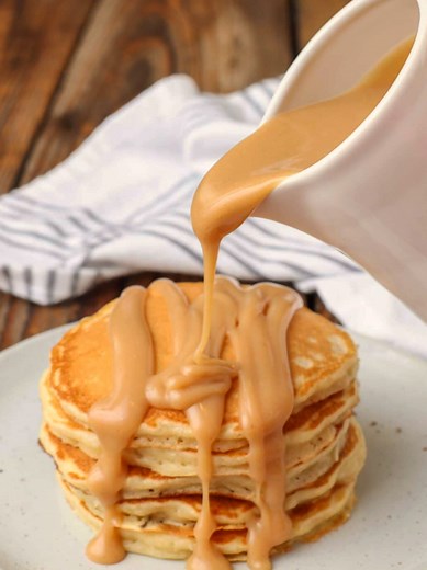 PEANUT BUTTER SYRUP Creamy, rich, peanut butter syrup makes a fantastic topping for your favorite stack of homemade pancakes or waffles. #GlutenFree Option ✔️ INGREDIENTS 2 tablespoons all-purpose flour ¾ cup sugar 1 ½ cups milk ½ cup creamy peanut butter 1 teaspoon vanilla extract 2 tablespoons butter GLUTEN-FREE ALTERNATIVE ¼ cup brown rice flour INSTRUCTIONS In a small saucepan, whisk together the flour and sugar. Add the milk and set the stove heat to medium. Whisk smooth and continue stirri