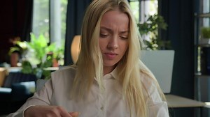 Stressed Caucasian businesswoman gen z girl female entrepreneur working in office with documents finances loss difficult business paperwork annoyed angry woman failure mistake papers stress overwork