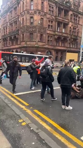 139K views · 779 reactions | Protestors are now having a stand off with police in Glasgow city centre. They are standing in front of the police van. Live updates: https://www.glasgowtimes.co.uk/news/25190874.live-protestors-occupy-glasgow-west-george-street-building/ | Glasgow Times | Facebook