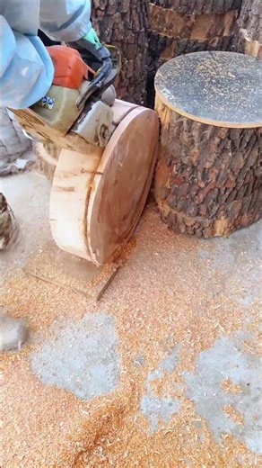 Skillful Carpenter Shaping Round Wood With Chainsaw Carving