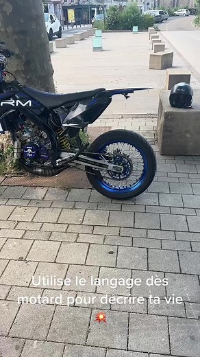 Stylish Black Motorcycle with Blue Accents in Urban Setting