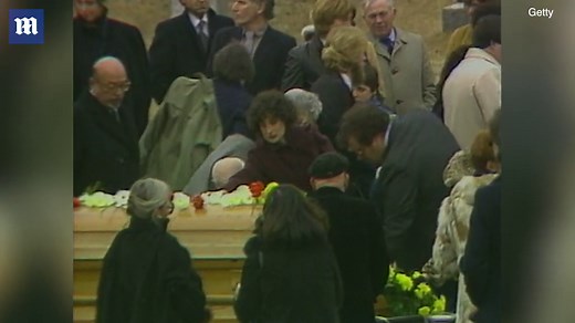 Somber family and friends attend the funeral of John Belushi