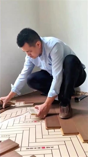 Precise Installation of Elegant Wooden Flooring with a Herringbone Pattern Design