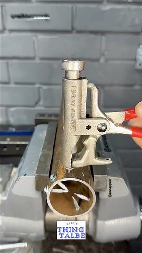 🛠️placing the nail in the guide and striking the spring loaded plunger with a hammer