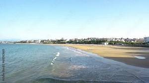 Beautiful El Sardinero beach, Santander , Spain. Stabilized static footage. People at the beach enjoying a sunny afternoon. Travel destination in North of Spain. View of Santander city, in background