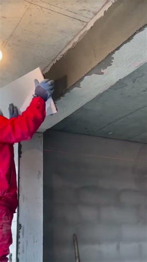 the process of installing rectangular ceramic tiles on the walls at the top of the building #popular