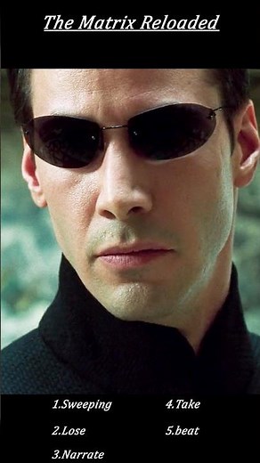 The Matrix Reloaded (2003) – Hero Stops Bullets with Outstretched Hand in Iconic Slow-Mo