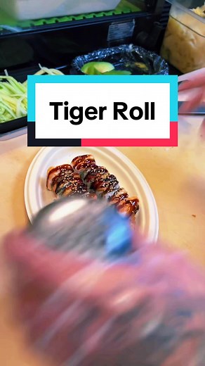 Tiger Roll! Shrimp tempura, cucumber and avocado. Tooped with sushi shrimp and baked eel. The sauce is eel sauce and sesame seeds! Would you try it?! #fyp #sushi #howto #usa #creatorsearchinsights