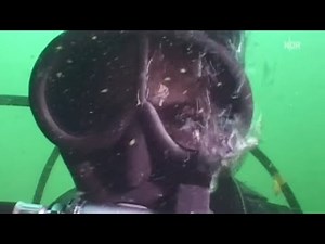 Female Diver is Diving with Poseidon Unisuit and Cressi Full Face Mask