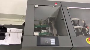 Paper collator with bookletmaker and edge trimmer. Book binding machine