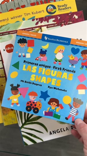 Ready Readers on Instagram: "🎥 Two of our volunteer readers explore “Primeros amigos: Las figuras / First Friends: Shapes” from @barefootbooks — a bilingual introduction to shapes! This vibrant board book invites readers to find shapes on every page—a playful, hands-on way to support early math skills and bilingual learning at an early age! 🟧 cuadrado, square 🔷 diamante, diamond 🌙 luna, moon 💜corazón, heart 🔺triángulo, triangle 🌈arco, arc 🎈óvalo, oval ⭐️estrella, star"