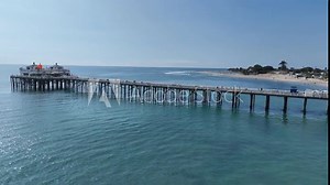 Malibu Pier At Los Angeles In California United States. Coast City Landscape. Beach Background. Malibu Pier At Los Angeles In California United States.