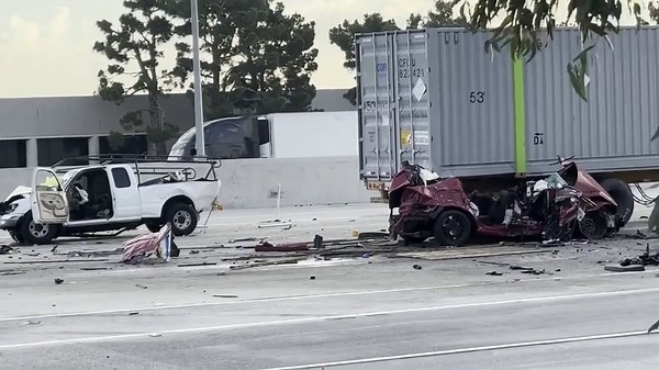 An eight-car collision including a semi-truck killed three people