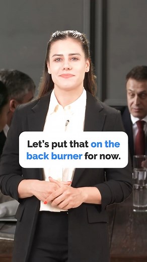 On the Back Burner – What It Means? 🔥 Not urgent? Put it on the back burner! Learn this useful expression. #fluentjoy #learnenglish #englishidioms #businessenglish #improveyourenglish #commonphrases | FluentJoy