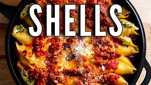 This stuffed shell recipe has a delicious ricotta, Pecorino Romano, spinach, and mozzarella cheese filling. They are baked with meat sauce on the top and bottom and covered with mozzarella cheese. | Sip and Feast