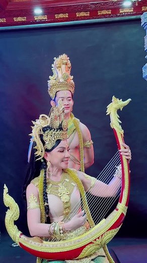 Traditional Harp Performance in Ornate Costumes