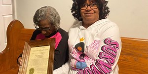Local church honors member with a plaque for turning 100