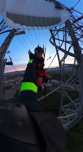 Cop Grabs Parachutist From Tower Peril!