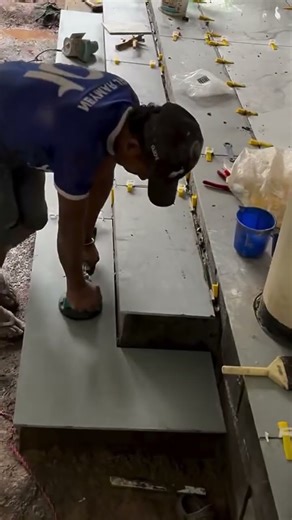 the process of installing tiles on the front steps of the house terrace #construction #tiles #shorts