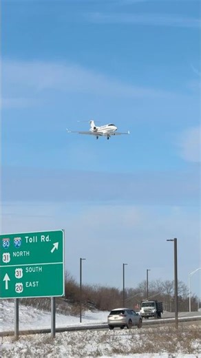 Embraer Phenom 300 landing runway 9R at KSBN