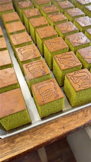 Adorable fluffy matcha castella cake with a branded design! #MieGourmet #Japanesefood