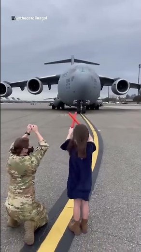 After 20 years of service, little girl marshals her dad in on his last flight