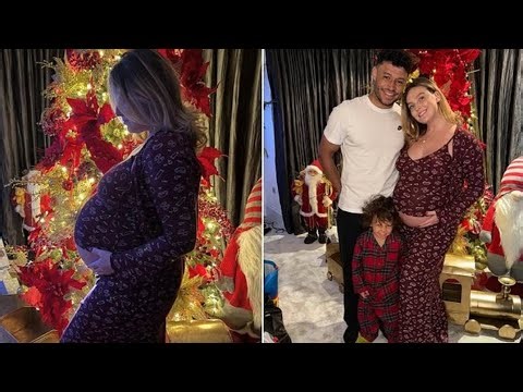 Perrie Edwards cradles her baby bump in sweet Christmas snaps as she nears her due date
