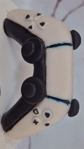 Neha| Cake Artist| DSM, Tanzania on Instagram: "​Why just play the console when you can bake it? I took the challenge of creating a homemade PS5 cake, and the results are a total win. ​Every inch of this build is packed with rich, velvet chocolate fudge. It’s heavy, decadent, and way more satisfying than hitting a high score. From the sleek "hardware" design to the fudgy center, this was a project I didn't want to put the controller down for. ​Rate my setup 1–10 in the comments! #ChocolateFudge 