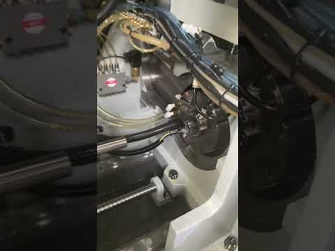 Setting a guide bushing on a Tsugami Swiss lathe.