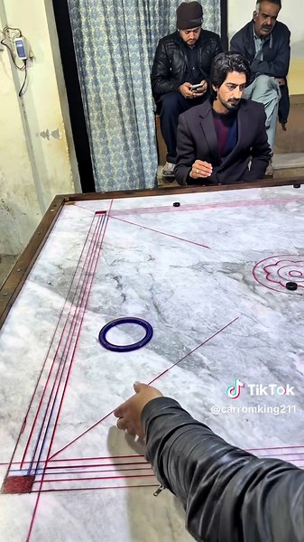 Achieving Carrom Mastery Through Skill and Focus