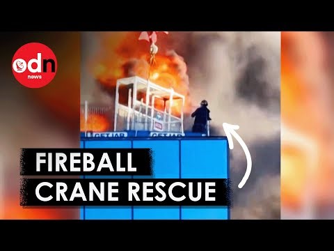Incredible Moment Crane Operator Saves Man From Towering Inferno