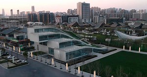 undulated hill-like planted steps merge contemporary art center in china with urban fabric
