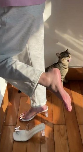 Girl shows barefoot in heel at home