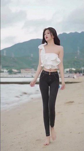 Barefoot Beauty in Jeans Strolling the Beach 🌊 #BeachVibes #Barefoot