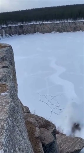 Massive Boulder Falls from Cliff and Shatters Frozen Lake