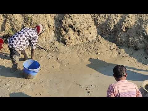 Waist-deep mud tells the story of village fishing.”#fishing 