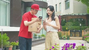 Delivery man Uniform smiles during express, courier holding a small package parcel Delivering goods to Customer's Home with Van Truck, door-to-door services.