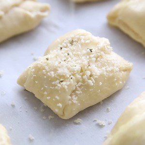 CREAMY CHICKEN CRESCENT ROLLS are a family favorite. Flaky crescent roll dough is filled with a creamy chicken mixture and topped with melted butter and seasoned bread crumbs. Plus you can freeze the leftovers! FULL RECIPE >> https://www.halfscratched.com/chicken-crescents-rolls/ | Half-Scratched