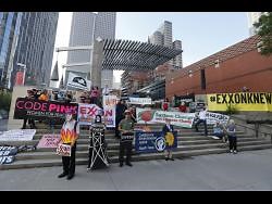 Investors press Exxon on disclosure of climate change impact