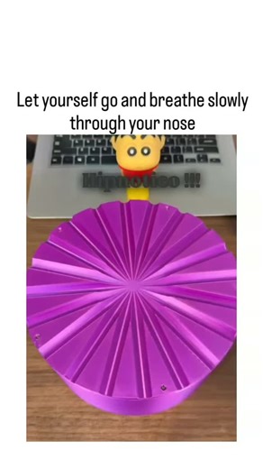 Follow for chocolate 🍫 on Instagram: "This X post shares a hypnotic induction video featuring a purple spinning wheel with white balls, paired with instructions for slow nasal breathing to promote relaxation, a technique rooted in visual entrainment that can induce alpha brain waves for trance states, as supported by studies on rhythmic photic stimulation (e.g., APA research on visual imagery and hypnosis susceptibility). Posted by @luneafaw on December 20, 2025, the content aligns with the use