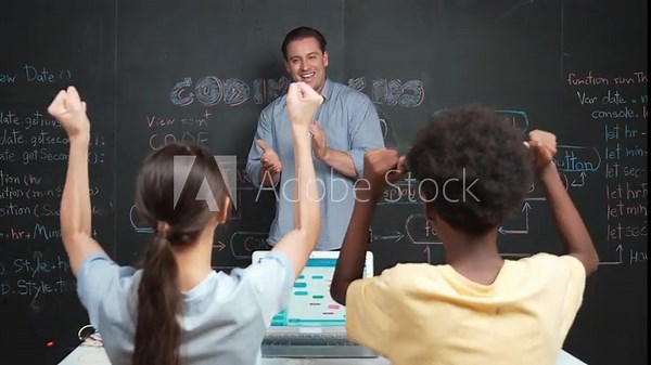 Handsome teacher clapping hands to celebrate successful project while diverse student raised arms with happiness. Instructor applause high school children to inspire to coding program Edification