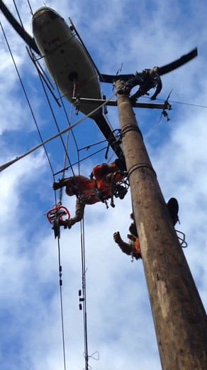 It's not often you stand at the bottom of a utility pole as linemen are working on it.⚡ Linemen are known for loving their jobs, and it's easy to see why. Each day is a new challenge, whether climbing poles, dangling from helicopters, or working in tough weather conditions. 🌩️ While they do get to experience unrivaled views, it's not a job to be taken lightly. You have to love it. 👉 Follow us for more linemen views! 🎥 @offer_u_cant_refuse on Instagram #americanmanufacturing #linemen #lineman 