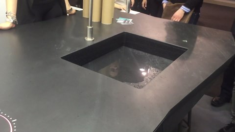 Invisible sink that descends into the kitchen counter