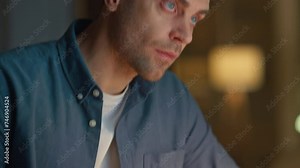 Involved man staring pc working late in home office closeup. Guy making notes