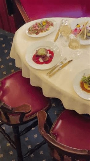 clip-3996168575-round-banquet-table-set-plated-courses-red