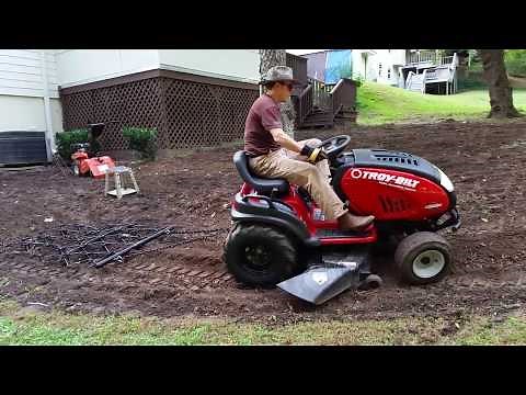 Pulling Drag Chain Harrow with Troy Bilt Garden Tractor Riding Mower for tilling garden soil Horse