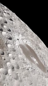 A small object was seen moving near the Moon surface during observation. It may look mysterious at first, but science offers clear explanations. Most of the time, such objects are space rocks (meteoroids), satellites, aircraft, birds, or debris passing between the camera and the Moon. Because the Moon has no atmosphere, objects crossing in front of it appear very sharp and can seem closer or slower than they really are. Camera zoom, distance, daylight, and viewing angle can easily create optical